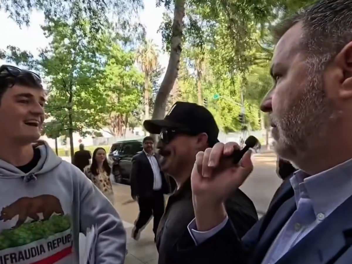 Nick Shirley via X A Democratic staffer, Terry Schanz, right, confronts independent journalist Nick Shirley outside the state capitol at Sacramento, California, on August 19, 2026, as Mr. Shirley was interviewing people about legislation dubbed by opponents as the "Stop Nick Shirley Act."