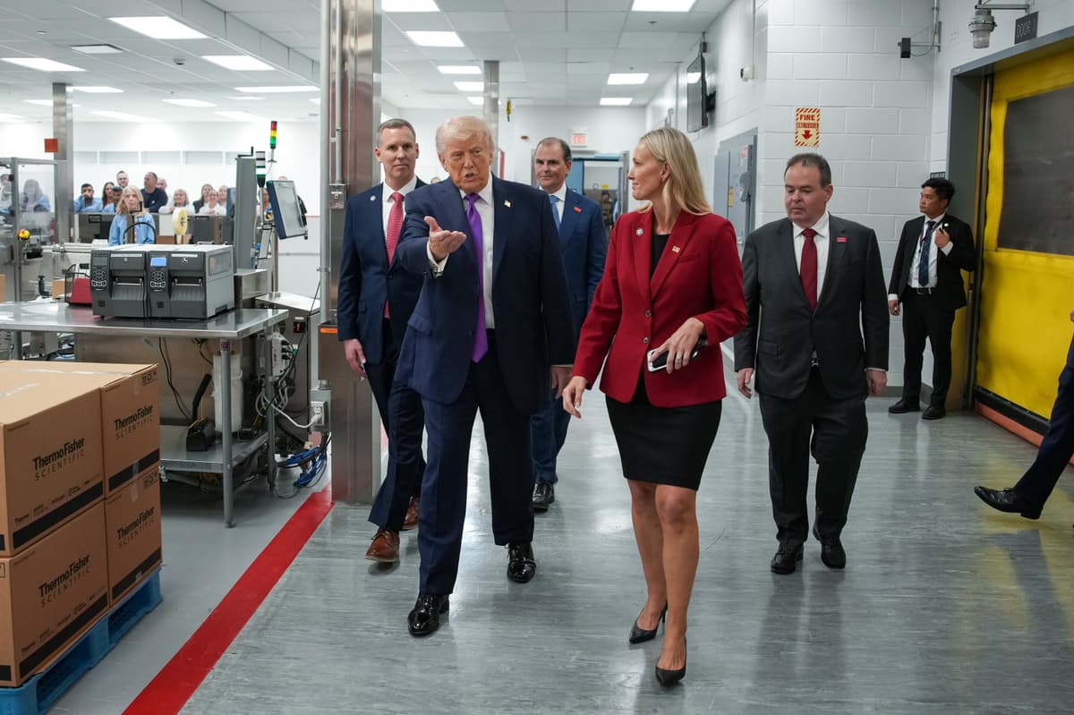 Andrew Harnik/Getty Images President Trump tours a Thermo Fisher Scientific facility at Reading, Ohio, on March 11, 2026.