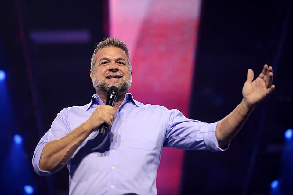 Via Wikimedia Commons The GOP nominee for governor of Colorado, Victor Marx, speaks with attendees at the 2022 AmericaFest at Phoenix, Arizona on December 20, 2022.
