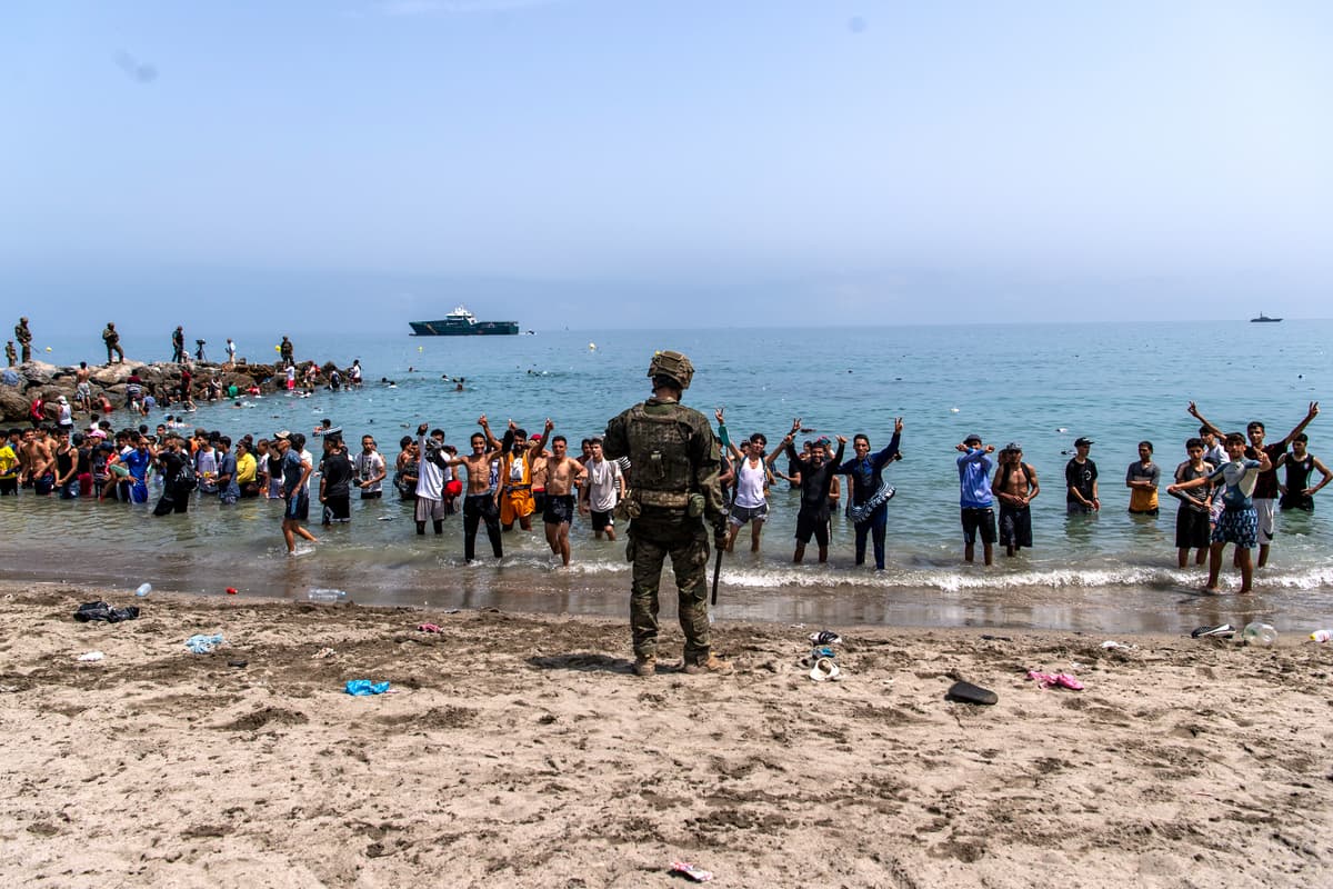 AP/Antonio Sempere Spanish army soldiers block access to the beach for people crossing from Morocco into the Spanish enclave of Ceuta, July 31, 2026.