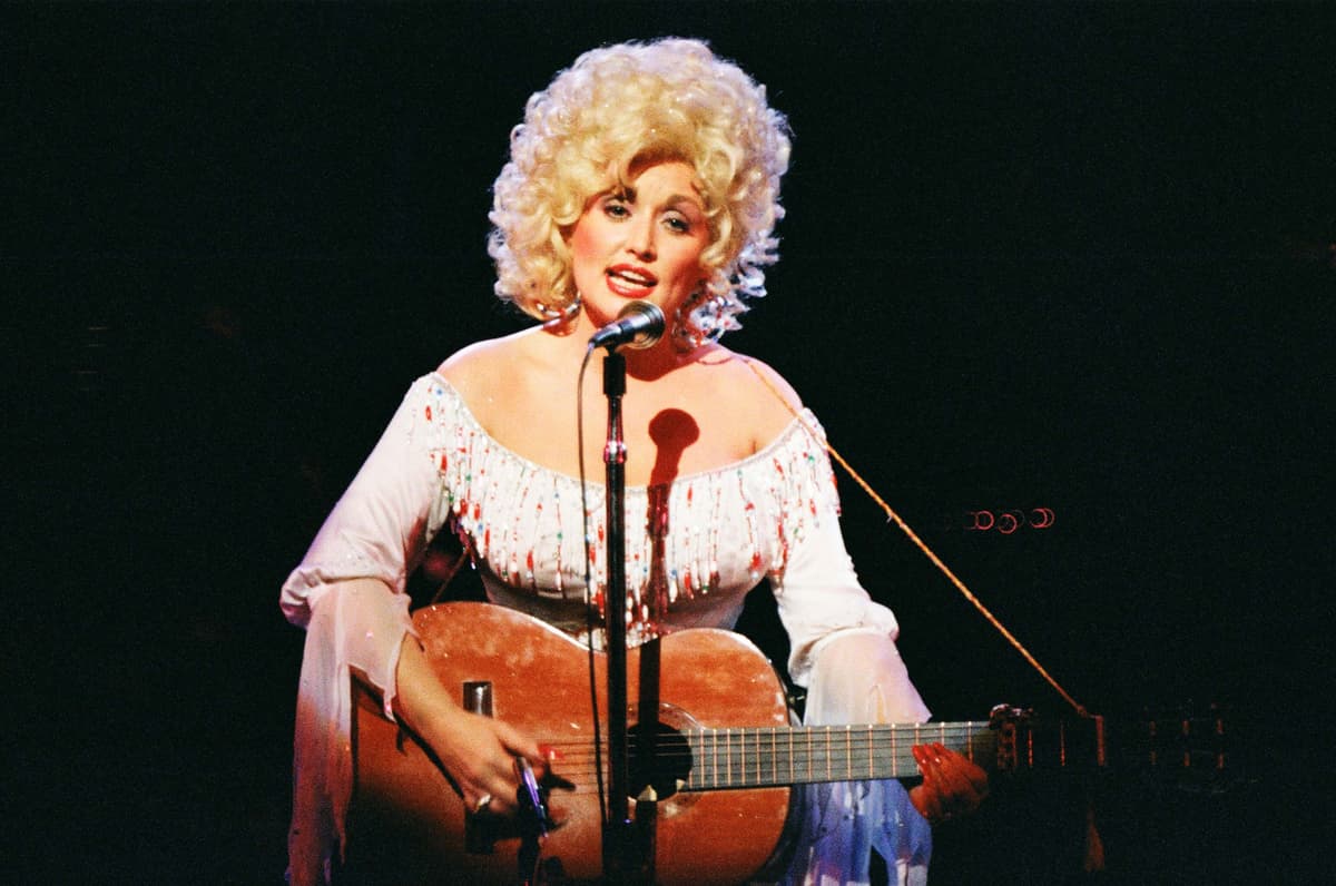 Pete Still/Redferns via Getty Images Dolly Parton performs on stage at London's Dominion Theatre on March 29, 1983.