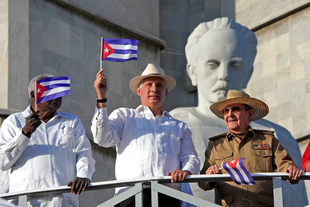 Sven Creutzmann/Mambo photo/Getty Images President Miguel Diaz-Canel of Cuba, center, next to Raul Castro, right, at Havana's Revolution square, May 1, 2019.