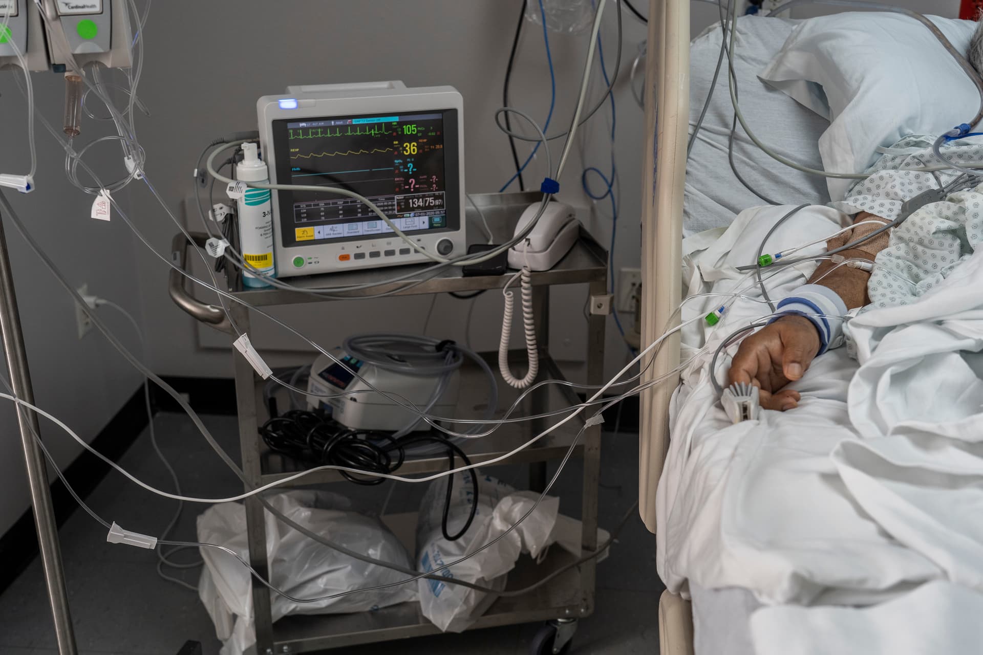 Nakamura/Getty Images A patient connected to medical equipment in an intensive care unit.