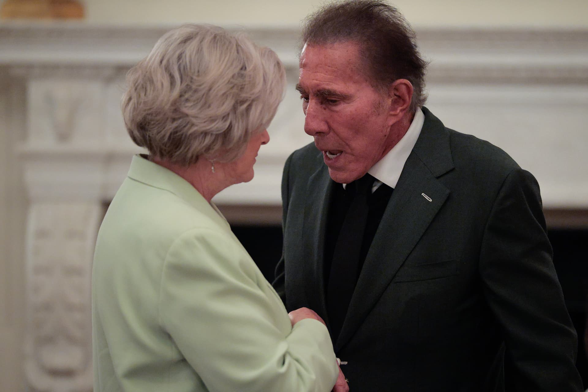 Chip Somodevilla/Getty Images White House Chief of Staff Susie Wiles speaks with casino and hotel magnate Steve Wynn at the White House on May 19, 2025.