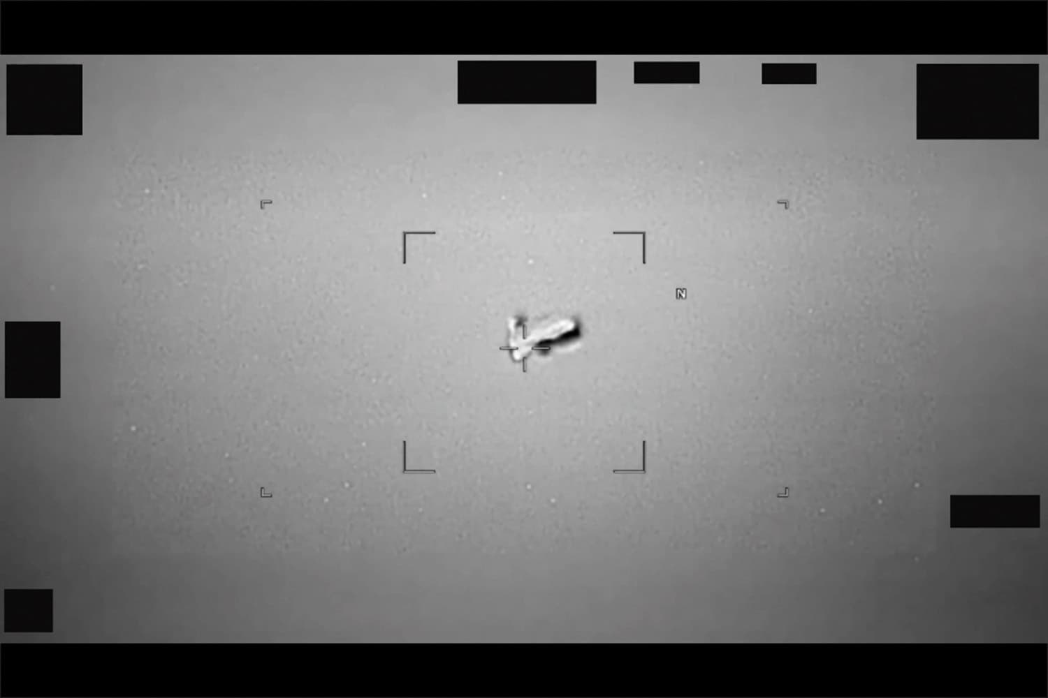 Photo US Department of War via Getty Images Department of War released image of a UAP that resembles a football-shaped body near Japan.
