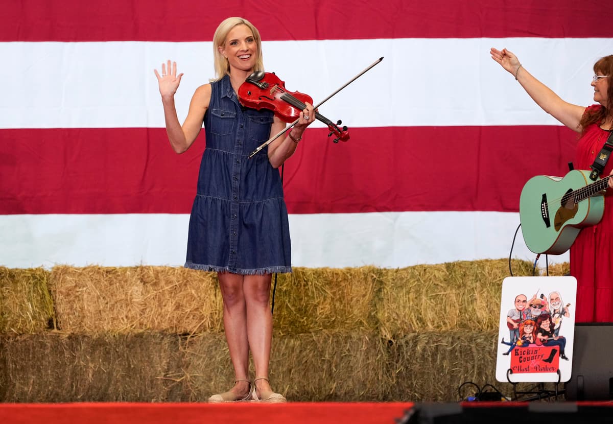 Charlie Neibergall/Getty Images Senate candidate and Congresswoman Ashley Hinson, a Republican from Iowa, plays the violin during her BBQ fundraiser at the Horizon Events Center on August 29, 2026, at Clive, Iowa.