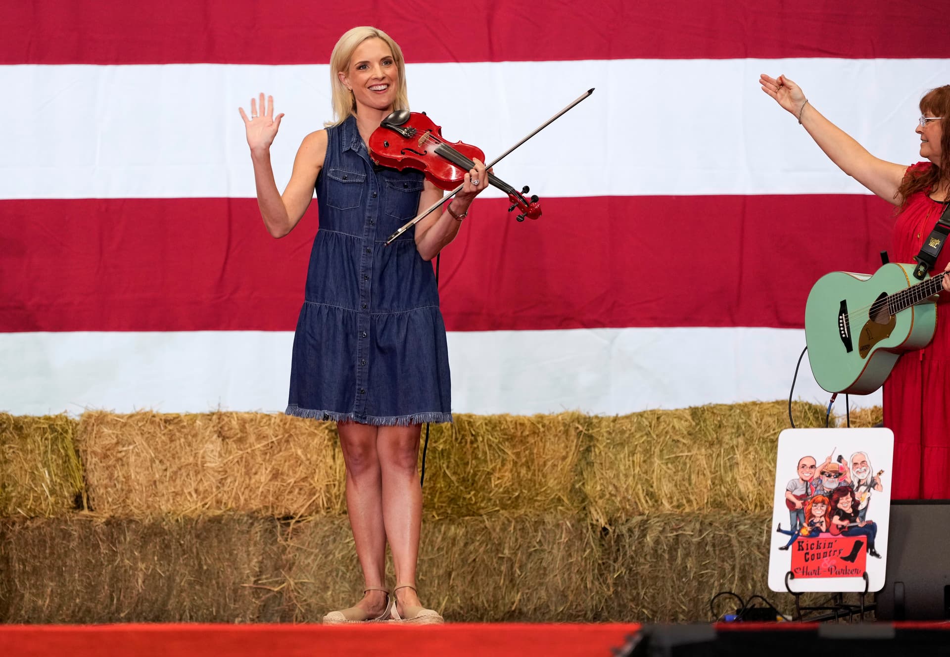 Charlie Neibergall/Getty Images Senate candidate and Congresswoman Ashley Hinson, a Republican from Iowa, plays the violin during her BBQ fundraiser at the Horizon Events Center on August 29, 2026, at Clive, Iowa.