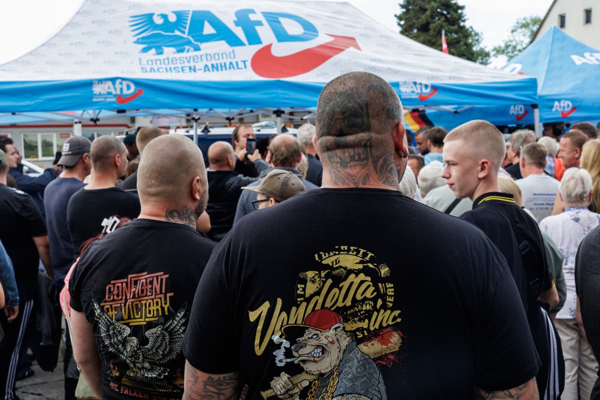 Jens Schlueter/Getty Images Supporters wait to have their photo taken with Ulrich Siegmund, lead candidate of the far-right Alternative for Germany (AfD), in Oschersleben, Germany, on August 31, 2026.