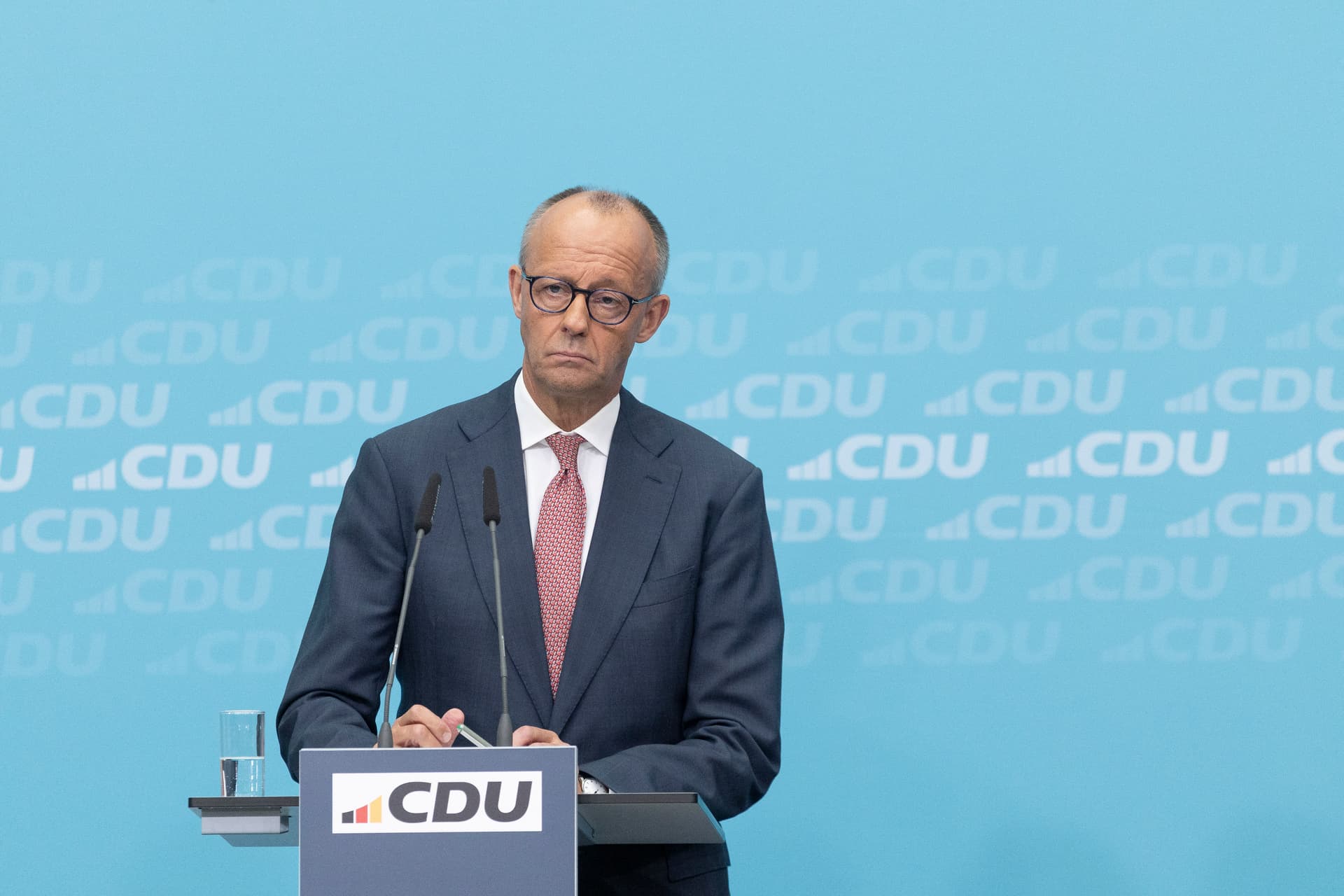 Maja Hitij/Getty Images Friedrich Merz addresses the press after his party lost two more state elections.