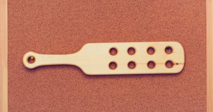 Getty Images A standard spanking paddle is described as being made of wood and roughly 15 inches long, two to four inches wide, and half an inch thick, with a six-inch handle.