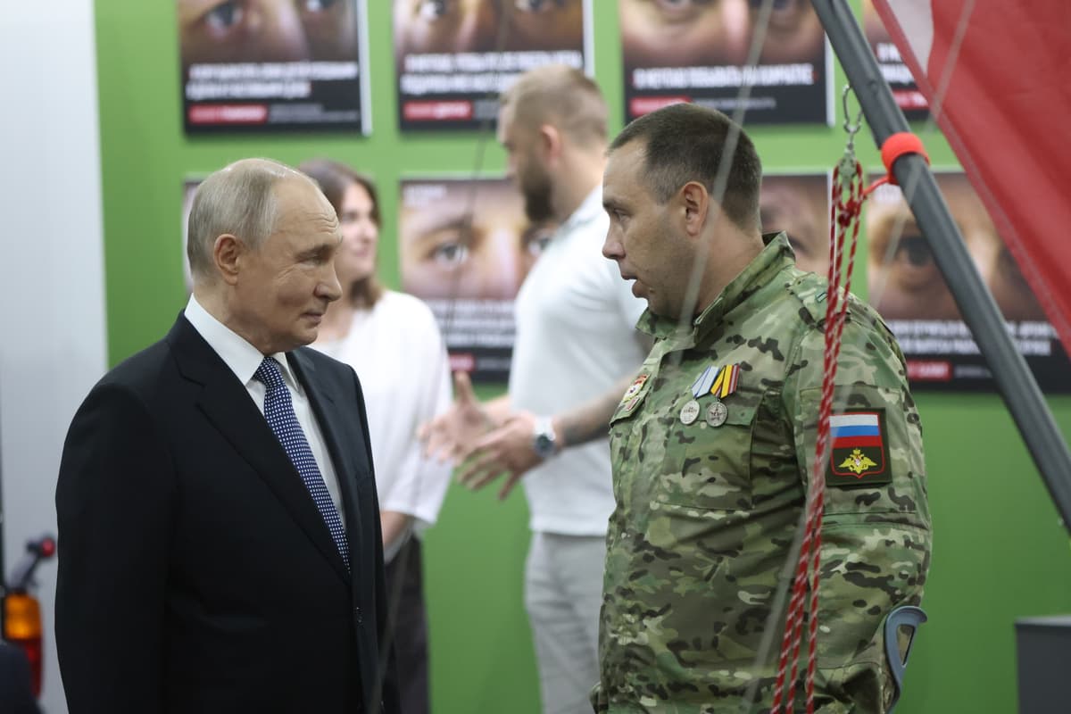 Contributor/Getty Images Russia’s president, Vladimir Putin, listens to a military serviceman while visiting an "Everything for Victory!" forum at Moscow on July 13, 2026.