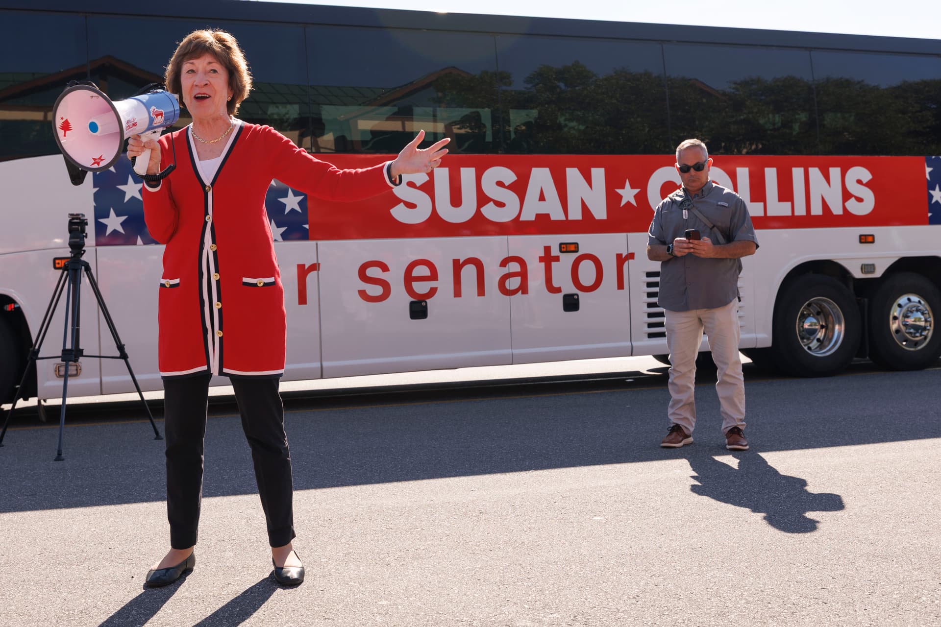 CJ Gunther/Getty Images Senator Susan Collins greets supporters outside the Kittery Trading Post, the first stop of a weekend re-election campaign bus tour of the state of Maine, on August 14, 2026.