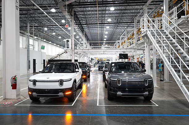 Scott Olson/Getty Images Rivian R2 SUV's at the company's assembly plant at Normal, Illinois.