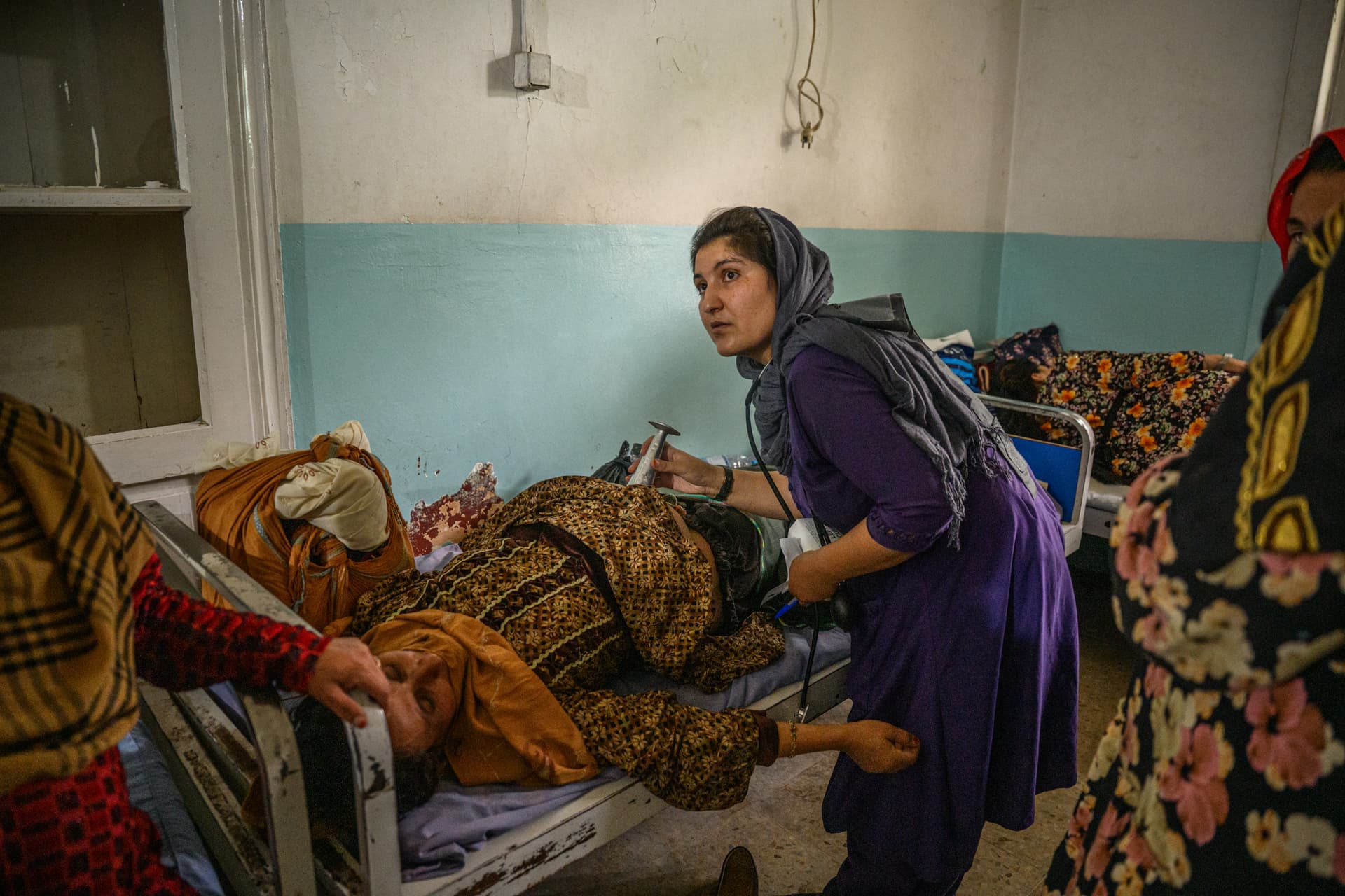 Elise Blanchard/Getty Images Farida, a midwife, monitors pregnant women close to delivering at a hospital maternity department at Ghazni, Afghanistan, on August 27, 2025.