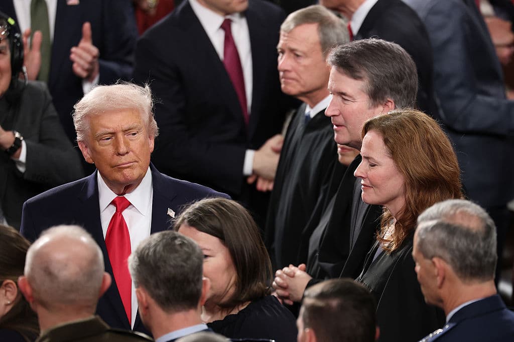 Win McNamee/Getty Images President Trump walks past Supreme Court Chief Justice Roberts, Justice Elena Kagan, Justice Brett Kavanaugh and Justice Amy Coney Barrett on February 24, 2026, at Washington, DC