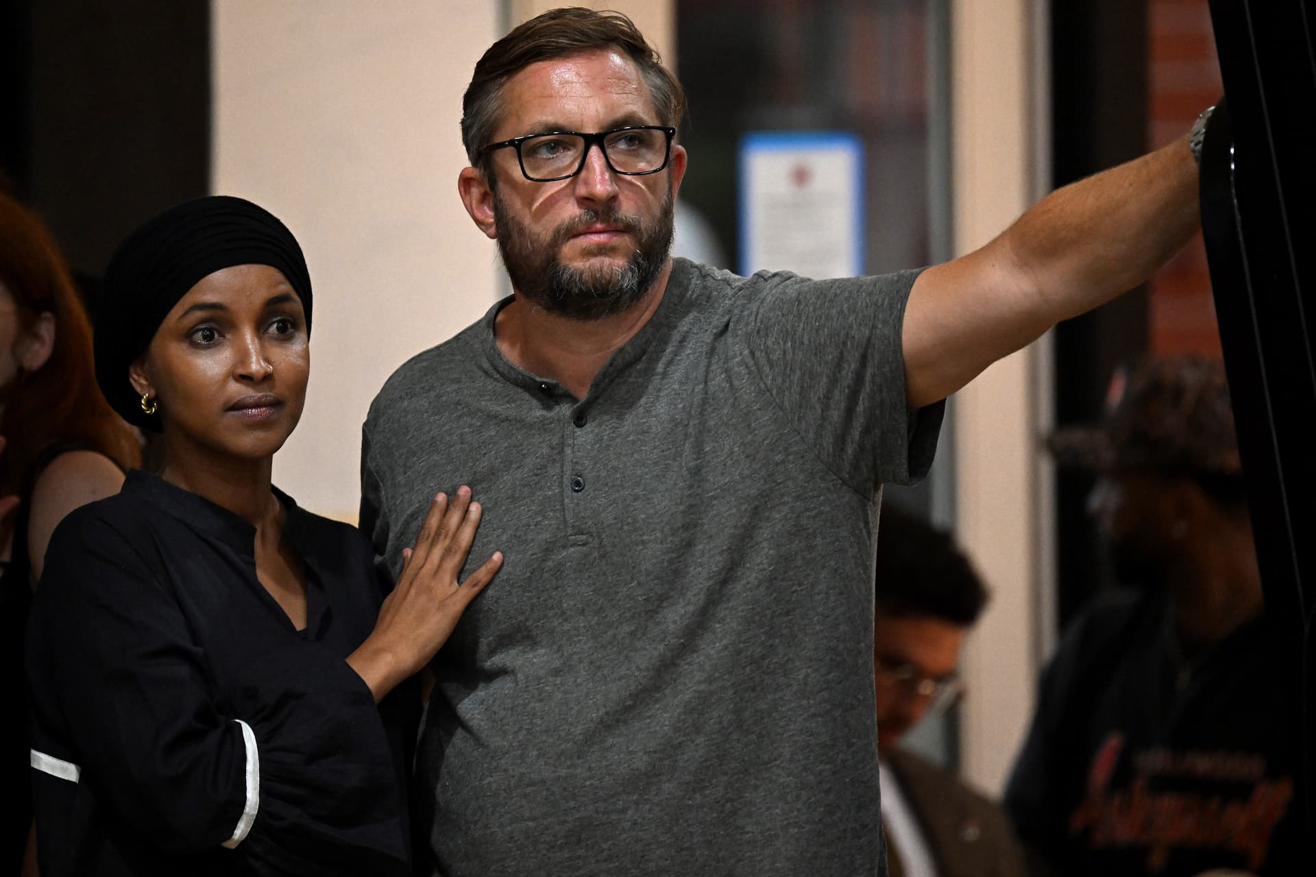 Joshua Lott/Getty Images. Ilhan Omar stands with her husband Tim Mynett.