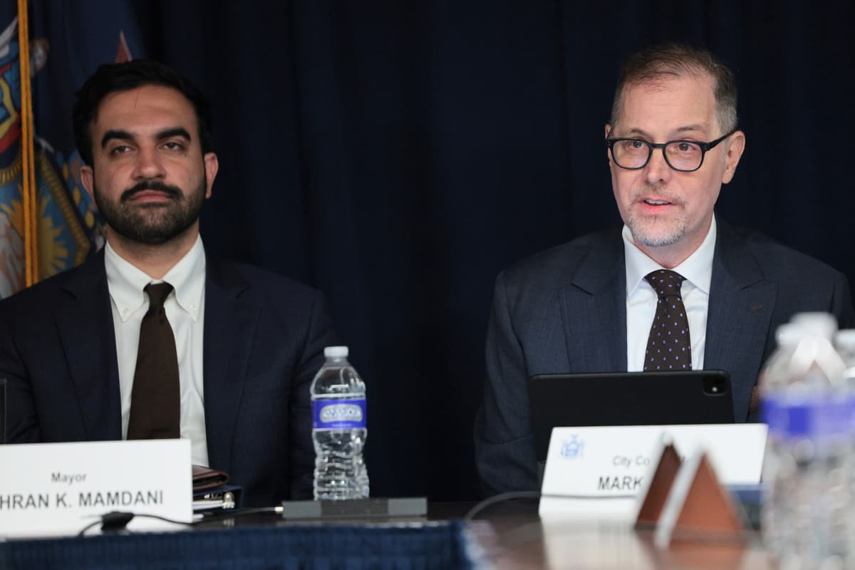 Michael M. Santiago/Getty Images. New York City Mayor Zohran Mamdani listens as New York City Comptroller Mark Levine speaks.