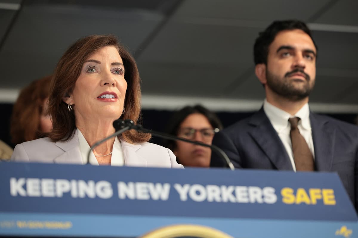 Michael M. Santiago/Getty Images. New York Gov. Kathy Hochul speaks as New York City Mayor Zohran Mamdani listens during a press conference.