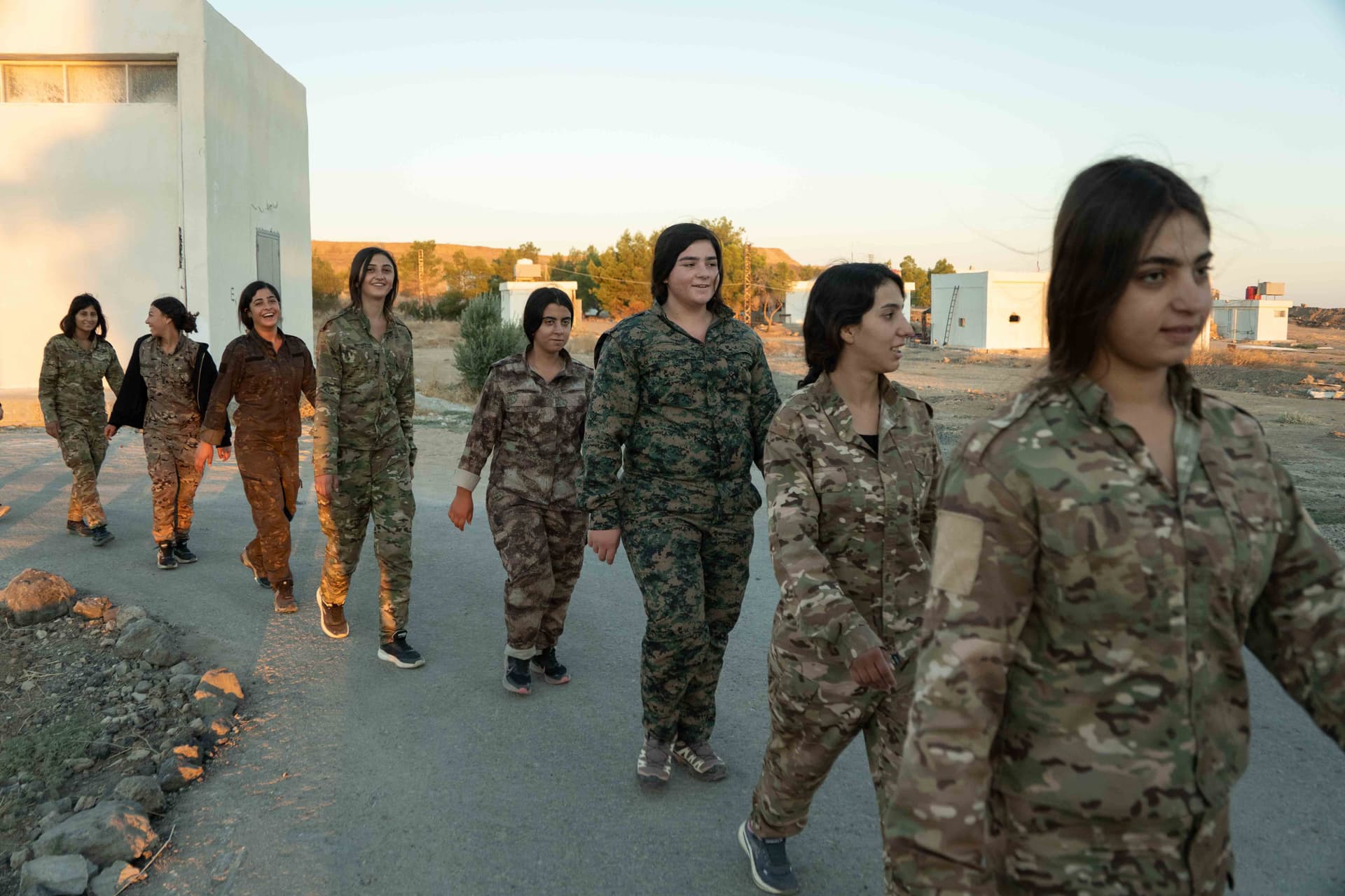 Anagha Subhash Nair/Getty Images Kurdish fighters belonging to the Women's Protection Units that battled ISIS walk at a military base at Hasakeh, Syria, on September 8, 2026.
