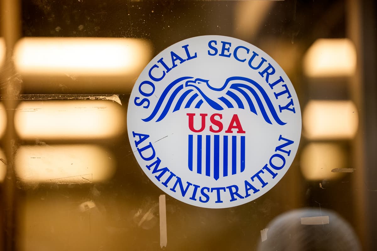 Andrew Harnik/Getty Images. The seal for the Social Security Administration is visible on the front door of one of their offices.
