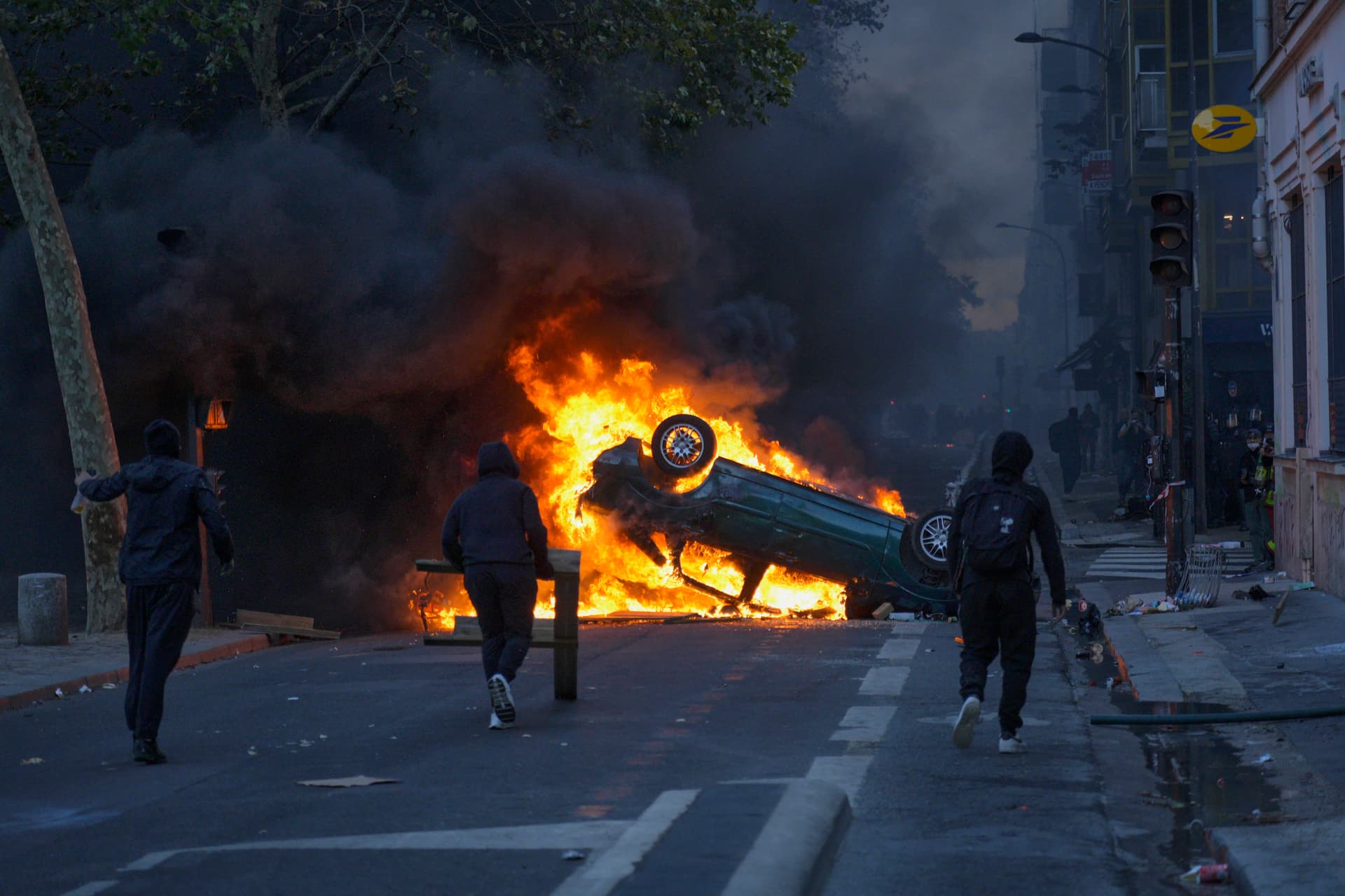 Remon Haazen/Getty Images. Rioters set cars on fire at the Canal Saint Martin during severe unrest in Paris, France.
