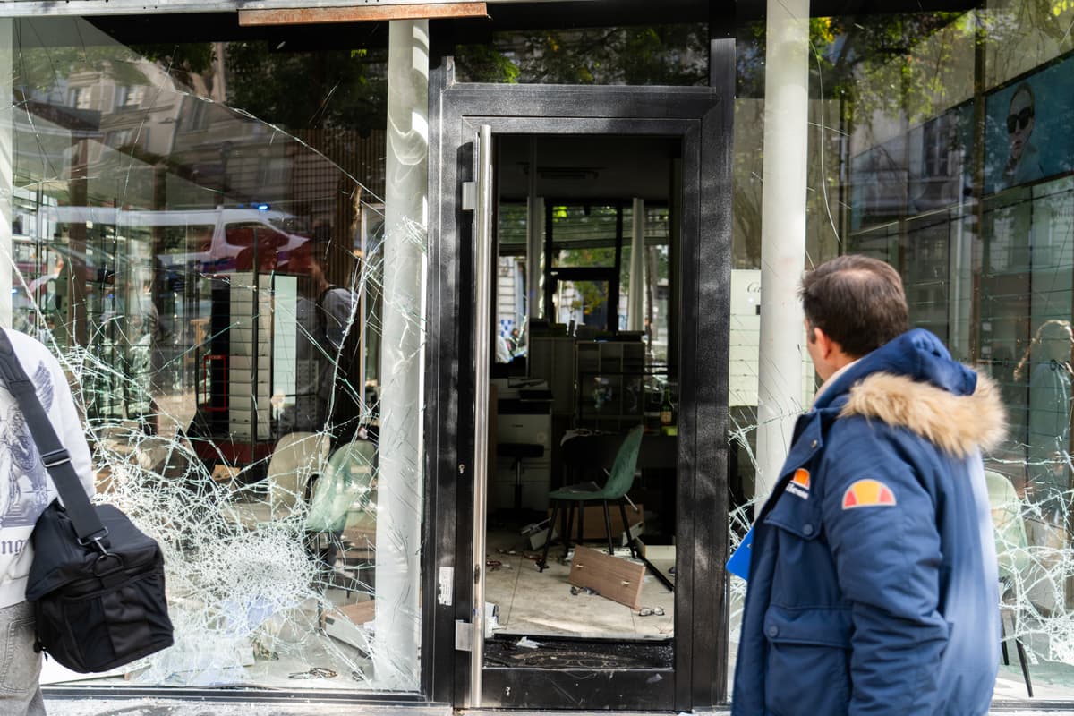 Tom Lartige Catillon/Getty Images Tourists look at the damage to shattered shop windows on Boulevard Magenta the day after the demonstration on October 18, 2026 at Paris, France.