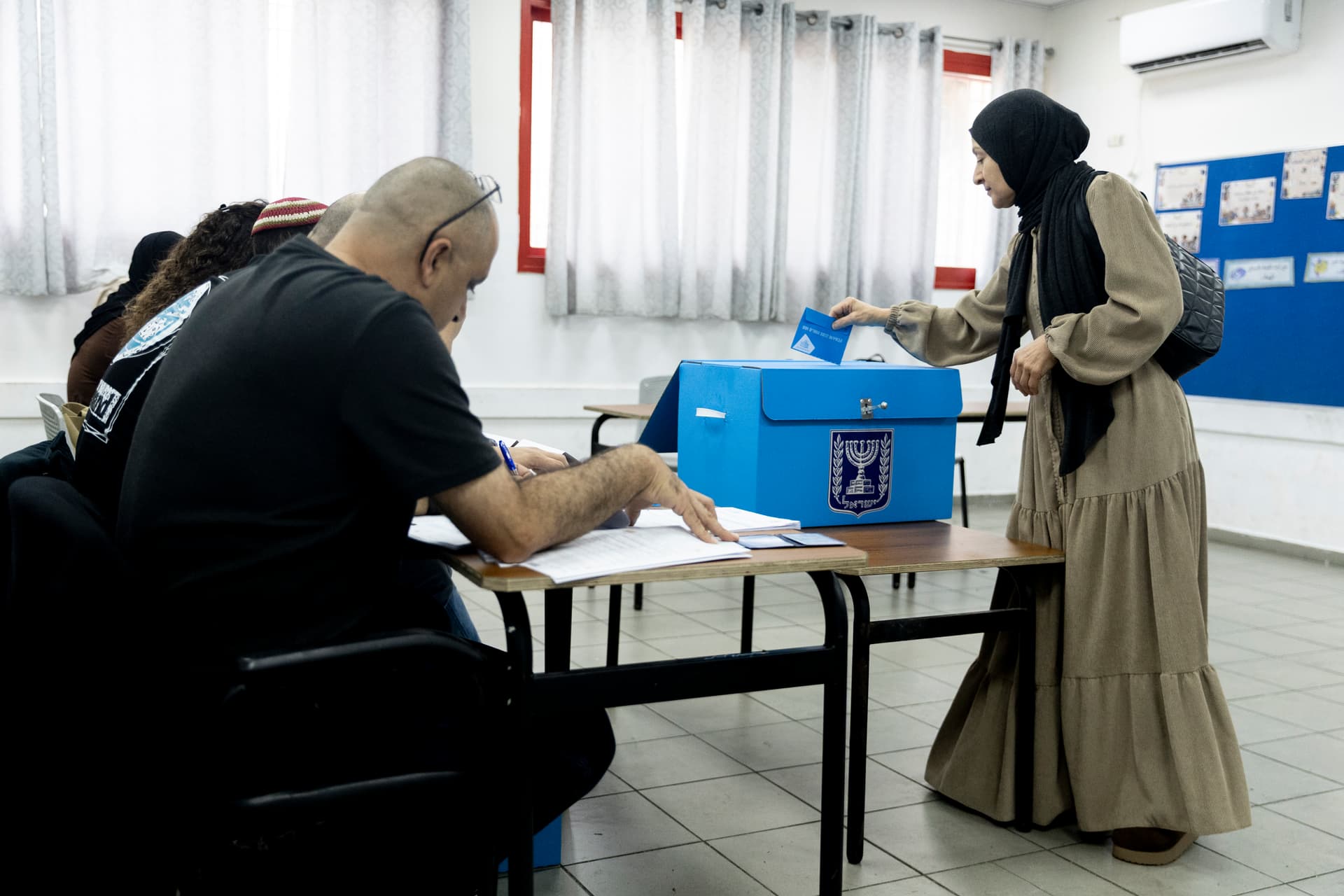Amir Levy/Getty Images An Arab-Israeli woman casts her ballot during Israel's general elections on October 27, 2026 at Umm El Fahem, Israel.