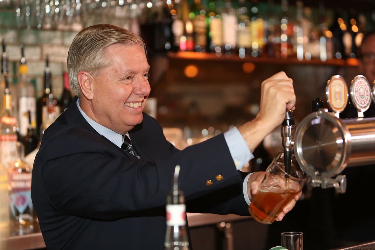 Jason Bahr/Getty Images Senator Lindsey Graham serves guests as part of CNN's Politics On Tap at Walnut Brewery on October 27, 2015 at Boulder, Colorado.