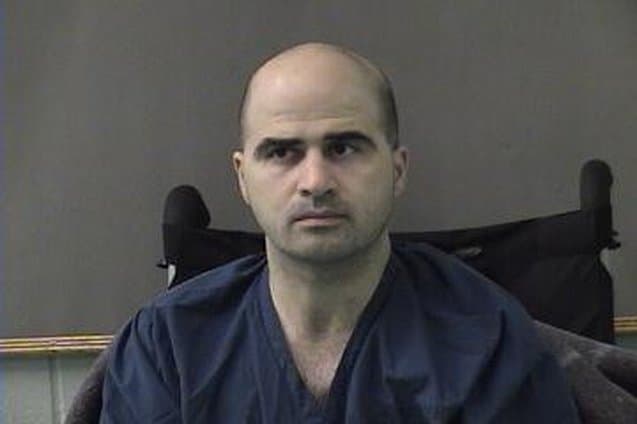 Bell County Sheriff's Office via Getty Images. Nidal Hasan is seen in a booking photo.