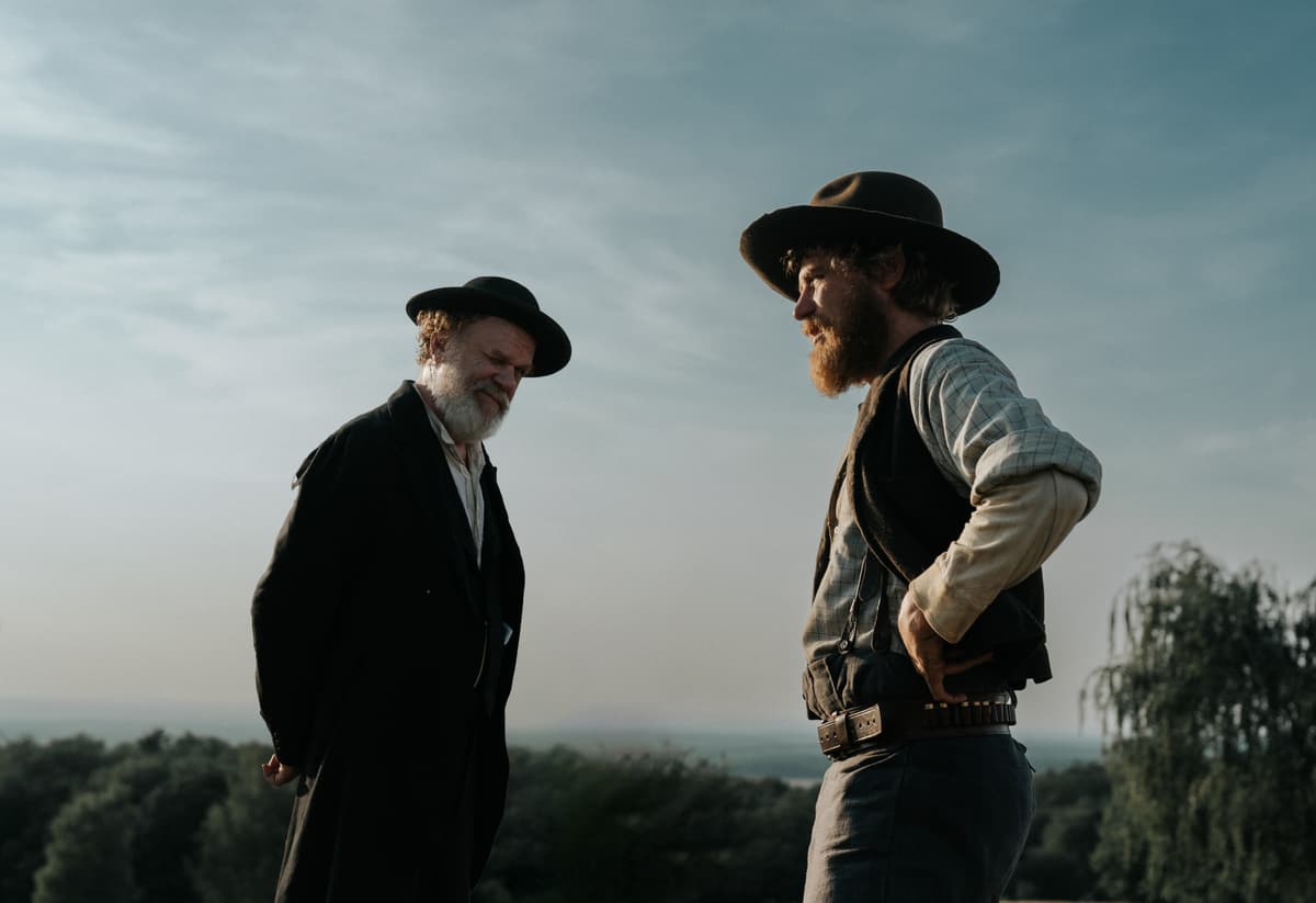 Quiver John C. Reilly and Johnny Flynn in 'A Prayer for the Dying.'
