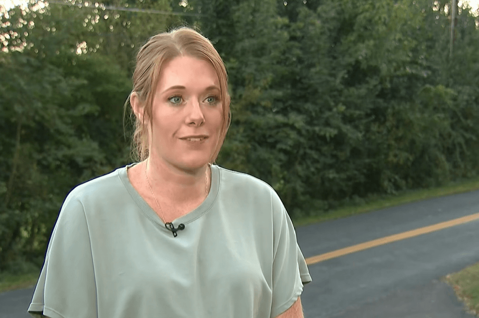 Via YouTube Harford County, Maryland, parent Carolyn Kalambihis speaks to a reporter beside the rural road where school bus driver Cyntia Morgan stopped her bus to rescue a kitten on October 8, 2026.