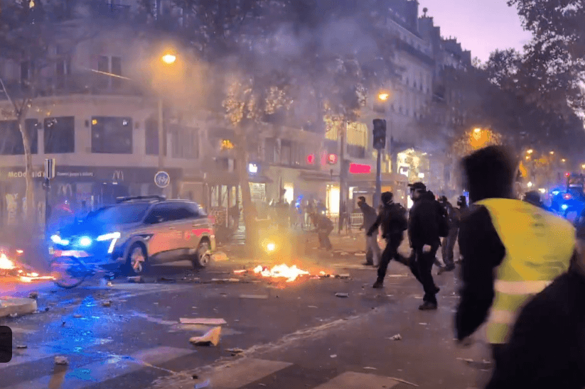Via X Masked and hooded protesters attack a police vehicle in this screenshot from an eyewitness video of demonstrations at Paris on October 17, 2026.