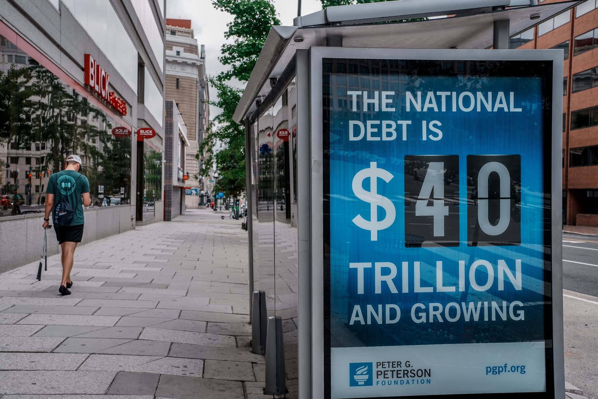 Jemal Countess/Getty Images for the Peter G. Peterson Foundation A bus shelter spotlighting the soaring national debt at Washington, D.C.