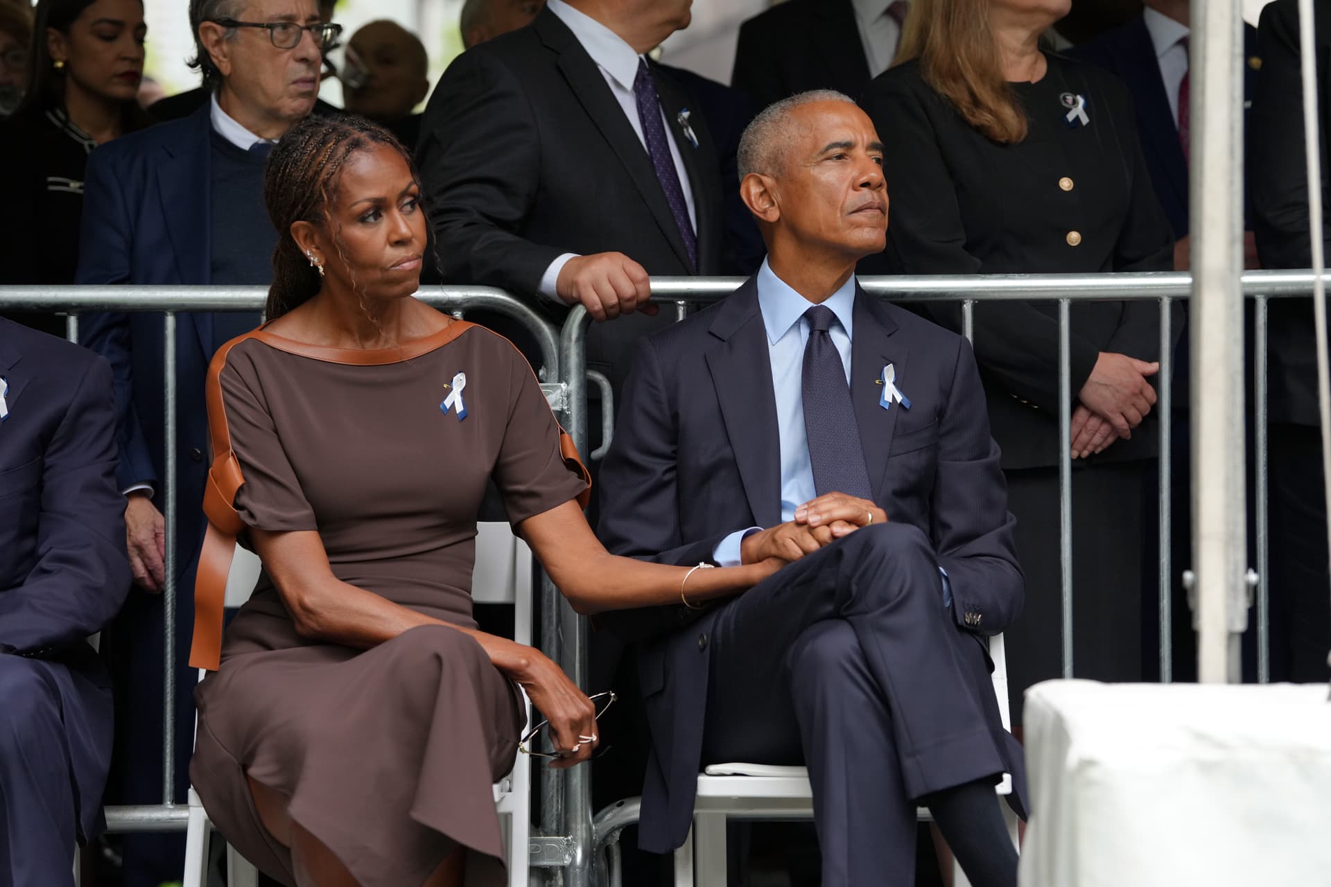 Hiroko Masuike - Pool/Getty Images First Lady Michelle Obama and President Obama attend the 9/11 25th anniversary commemoration ceremony at the National 911 Memorial and Museum on September 11, 2026.
